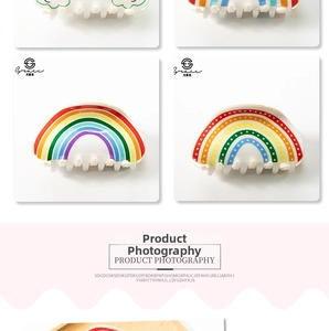 Detailed view of colorful PVC rainbow claw clips with secure serrated teeth for styling