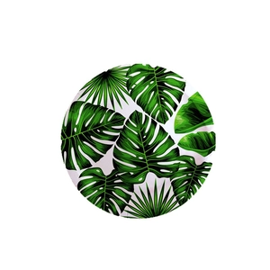 Disposable round paper plate with green tropical palm and monstera leaf prints