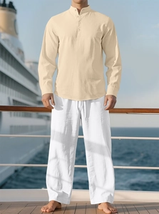 Men's casual beige linen-blend shirt and white trousers set on a cruise ship deck