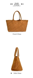Detail view of woven brown leather tote bag showing spacious interior and twin handles
