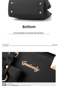 Detail of black pebbled leather bag with golden protective feet and Ganbanly logo