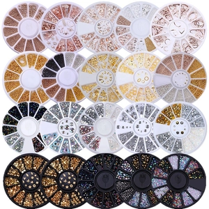 Assorted gold and silver nail art charms featuring moons and stars in organizer cases
