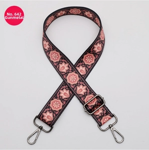 Close-up of ethnic style pink lotus pattern bag strap with gunmetal swivel hooks