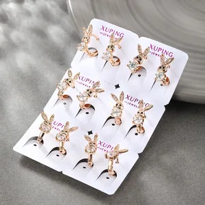 Exquisite rabbit earrings set in gold finish with sparkling zircons on display card
