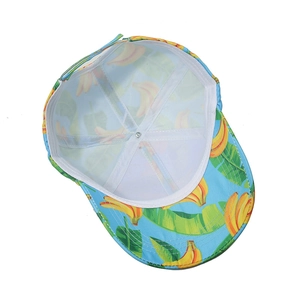 Detail of tropical banana leaf baseball cap showing white mesh lining and neat stitching