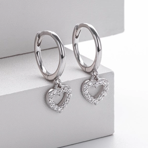 Close-up of S925 sterling silver heart earrings with micro-inlaid clear crystal details