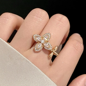 Elegant rose gold flower open ring with sparkling zircon petals for women in close-up