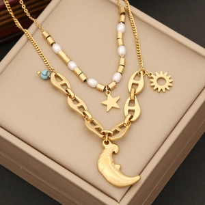 Double-layer gold stainless steel necklace featuring star moon pendants and pearl beads