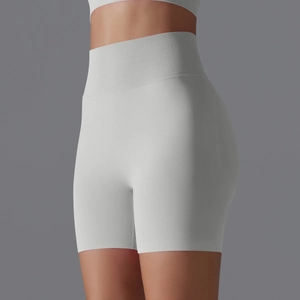 Detail of light grey seamless yoga shorts featuring a high ribbed waist and lifting effect