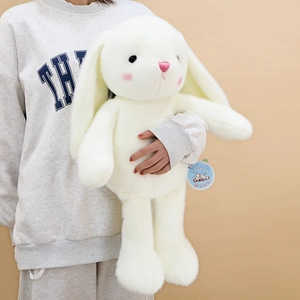 Large white plush rabbit toy with long ears and pink satin nose held by a model