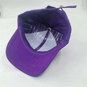 Internal view of purple sun hat with interior plastic support and metal strap buckle