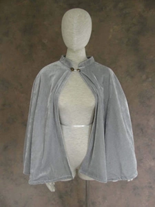 Short grey velvet Christmas cape with a sparkling button closure on a dress form