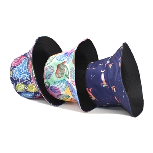 Reversible bucket hat with marine life prints and solid black inner lining