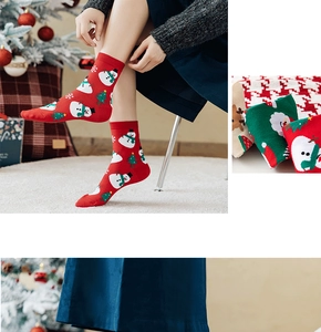 Detail of Christmas themed crew socks featuring reindeer and snowman patterns on soft cotton
