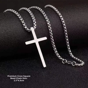 Polished titanium steel cross pendant 2.5x4.0cm with box chain on black texture