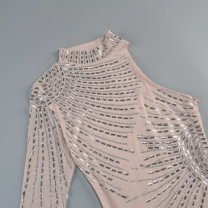 Detail of nude mesh turtleneck dress with sparkling silver rhinestones and side zipper