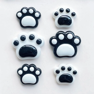 Glossy black and white cat paw resin charms for DIY phone cases and hair accessories