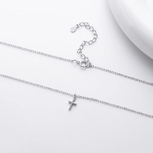 Detailed view of S925 sterling silver cross pendant featuring sparkling cubic zirconia stones