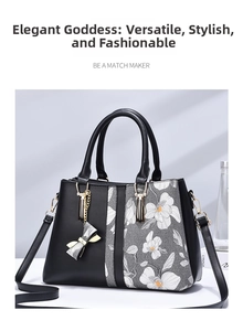 Detail view of large capacity floral tote with detachable strap and bow charm