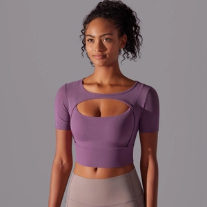 Detail of purple sports top featuring a front cutout and layered mesh patchwork design