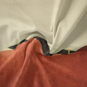 Close-up of bohemian tapestry fabric with abstract color blocks and fine woven texture