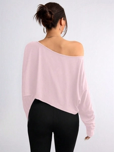 Detailed back view of pink off-shoulder long sleeve top with soft knitted texture
