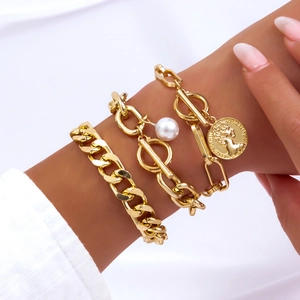 Gold layered bracelet set featuring pearl charm, coin pendant and chunky chain link style