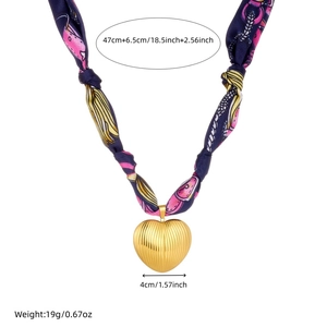 Detail of bohemian heart pendant necklace showing measurement of 47cm length and 4cm width