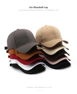 Multiple colors of minimalist cotton baseball caps stacked showing various trendy shades