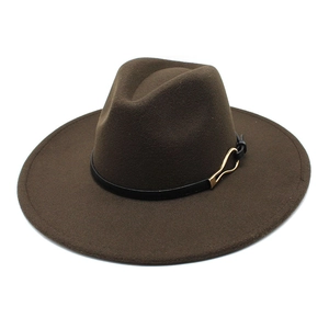 Close-up of dark brown wool fedora hat featuring a black leather band and gold metal buckle