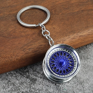 Silver and blue mesh alloy BBS style car wheel hub keychain for auto enthusiasts