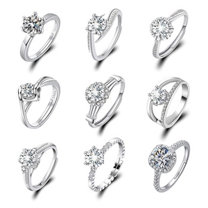 Macro shot of 9 diverse S925 sterling silver rings with 1 carat sparkling white stones