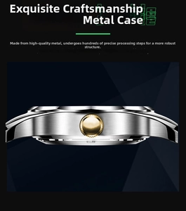 Close-up of brushed stainless steel watch case with a textured gold-tone crown detail