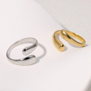 Minimalist stainless steel open rings in gold and silver with teardrop bypass design