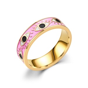 Detailed view of pink enamel evil eye ring with gold finish and vibrant eye patterns