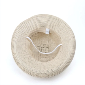 Women's summer beige straw sun hat with large bow and windproof strap for beach wear