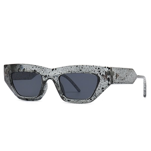 Cat eye blue light glasses with ink splash pattern frame and dark gray lenses
