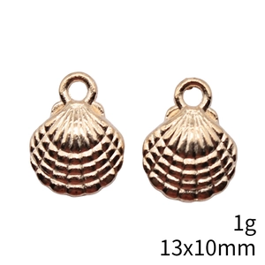 Macro detail of 13x10mm golden shell alloy pendants weighing 1g for jewelry making