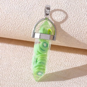 Detail of a resin hexagonal prism pendant with green kiwi slices and silver bail