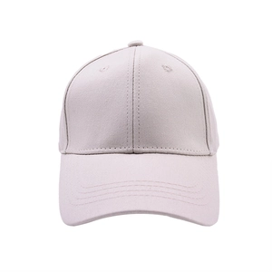 Close-up of a light grey cotton baseball cap showing six-panel stitching and eyelet details