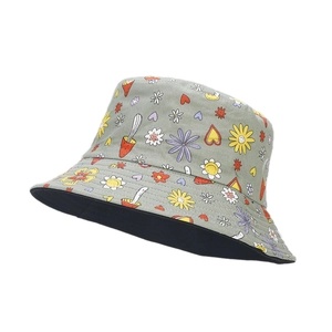 Reversible bucket hat with green flower and mushroom prints for outdoor sun protection