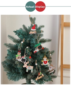 Detailed close-up of cartoon wooden Christmas ornaments hanging on a tree branch