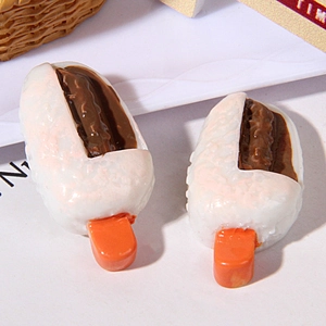 Macro detail of two resin popsicle miniatures with white coating and chocolate filling