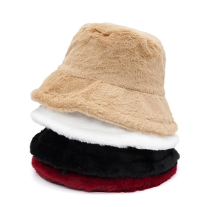 Vertical stack of plush rabbit fur bucket hats in khaki, white, black, and wine red colors