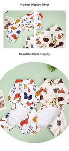Detail view of cotton pet pajamas showing cute cat and tropical animal cartoon prints