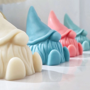 Set of four colorful Santa Gnome silicone molds for DIY scented candles and gypsum ornaments