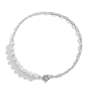 Detail of necklace with silver chain, white pearls and floral toggle clasp closure