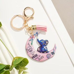 Artistic crescent moon elephant keychain with pink leather tassel and inspirational quote