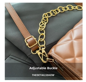 Detail of brown quilted shoulder bag with gold chain and adjustable metal buckle