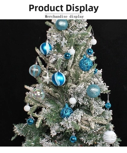 Detail of blue and white Christmas ornaments with glitter and snowflake patterns on tree